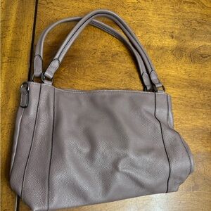100 percent leather Over earth purple tint and  brown tint  bag. Great condition